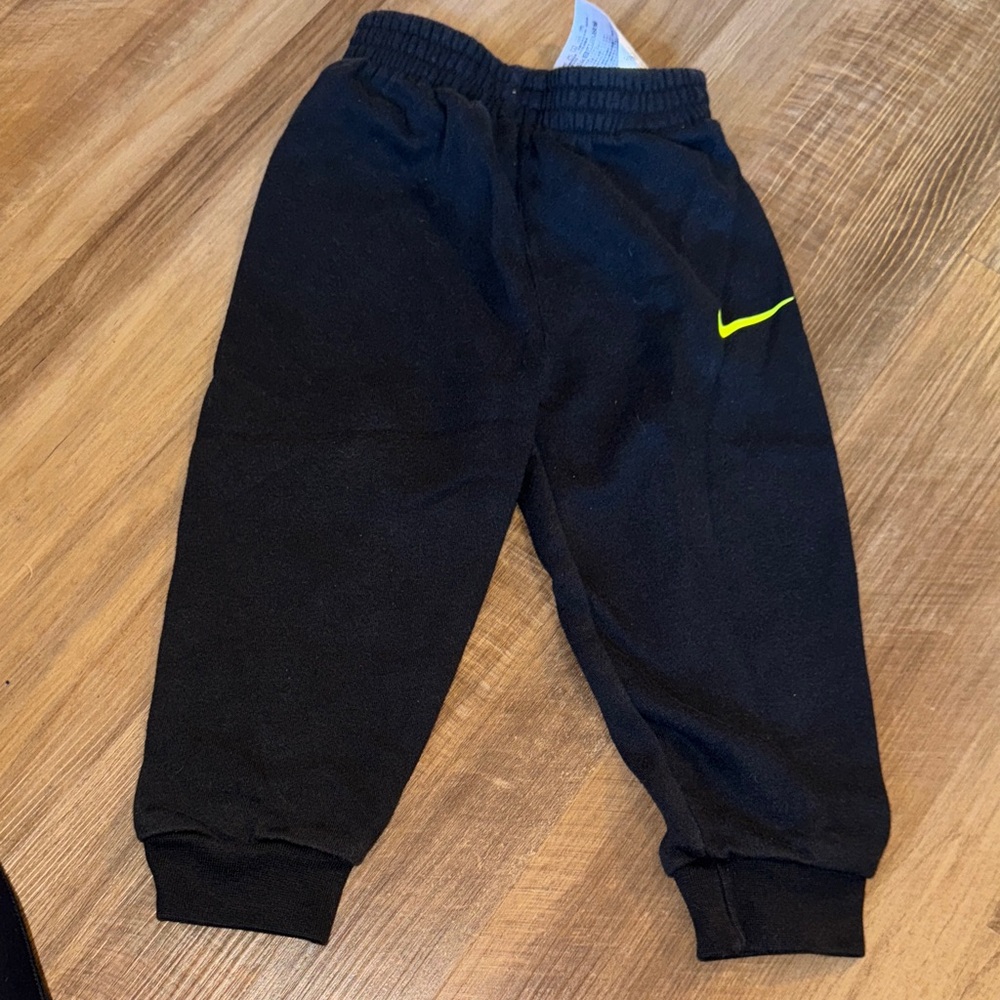 Nike Kids Black Joggers with Yellow Swoosh